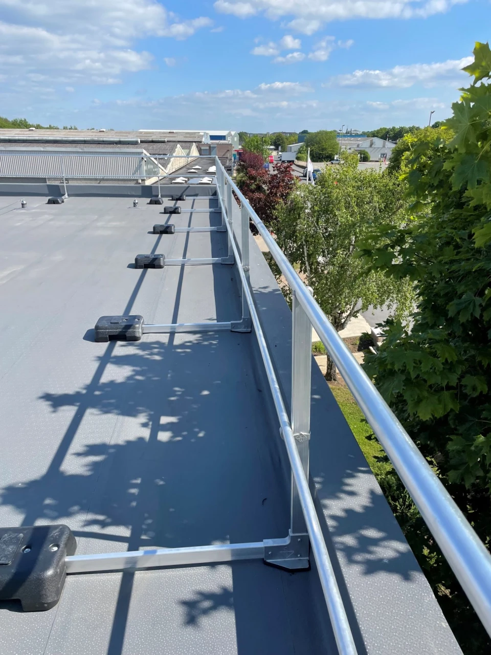 Permanent Guard Rails For Rooftops Why a roof guardrail is one of the best pieces of height safety ...
